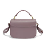Small women's handbag in mauve color with top handle and shoulder strap