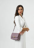 Stylish women's shoulder bag in a mauve color with a practical, medium-sized design