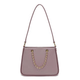 Elegant women's shoulder bag in mauve with gold metallic details
