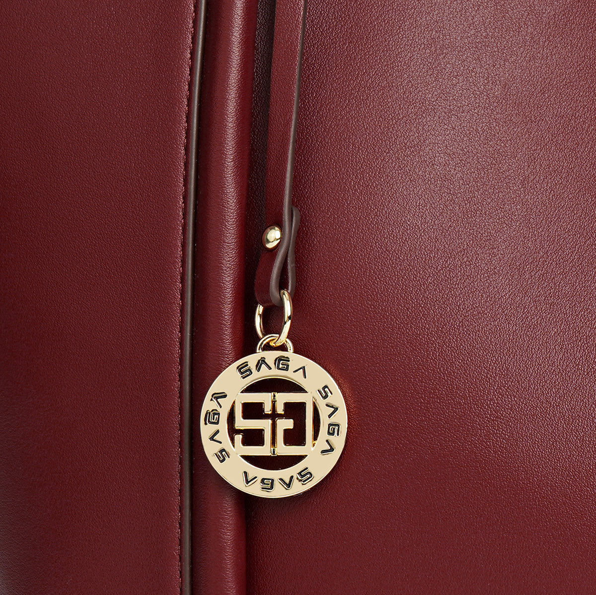 A spacious handbag characterized by elegance, width 34 cm, in red, maroon or blue