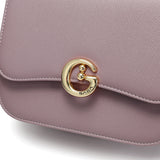 Stylish women's shoulder bag in a mauve color with a practical, medium-sized design
