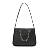 Elegant women's shoulder bag in mauve with gold metallic details