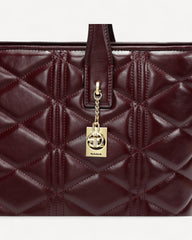 Luxurious maroon lined leather handbag and shoulder bag - a feminine touch that highlights your elegance