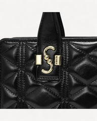 Luxury leather handbag and shoulder bag with a classic, luxurious design - black with gold accents