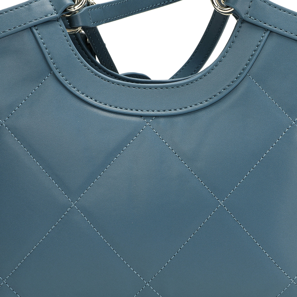 Luxury leather bag with a distinctive handle and light size, blue colour